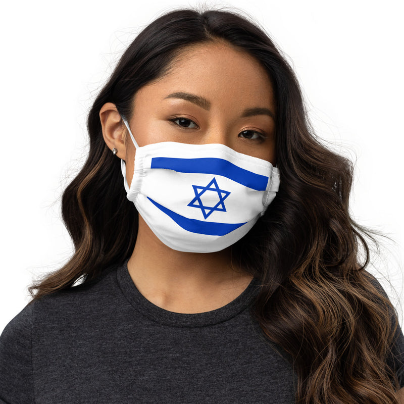 A close up of a woman's face wearing a premium white face mask with the Israel flag imprinted in blue